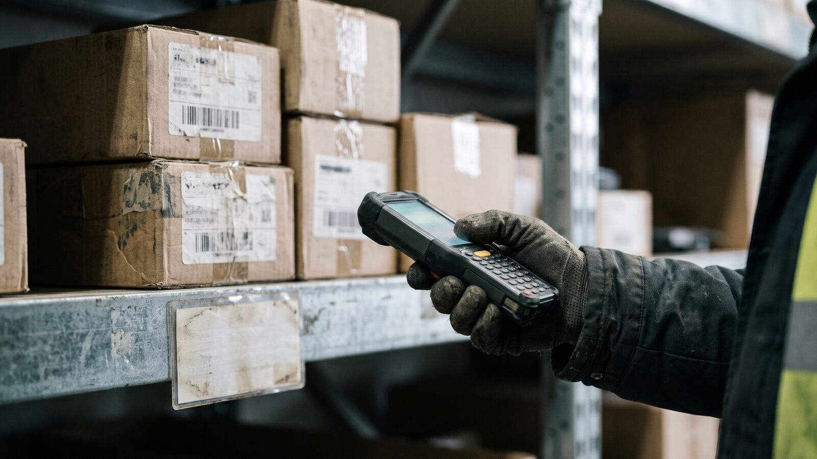 Warehouse bin of bearings with a handheld scanner